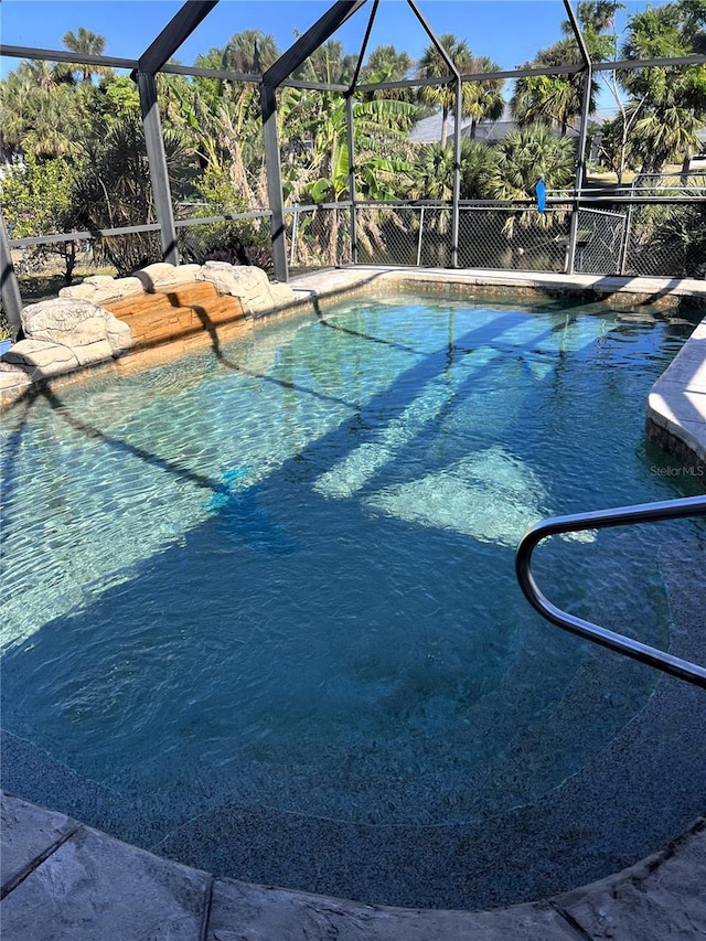 view of pool featuring a lanai