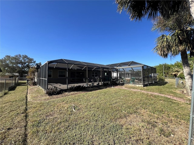 view of yard with glass enclosure