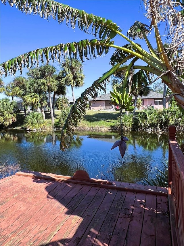 view of dock featuring a deck with water view