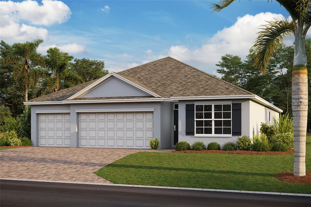 single story home featuring a garage and a front lawn