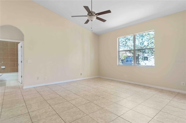 tiled empty room with ceiling fan