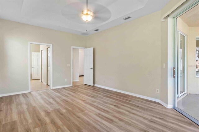 spare room with ceiling fan and light hardwood / wood-style flooring