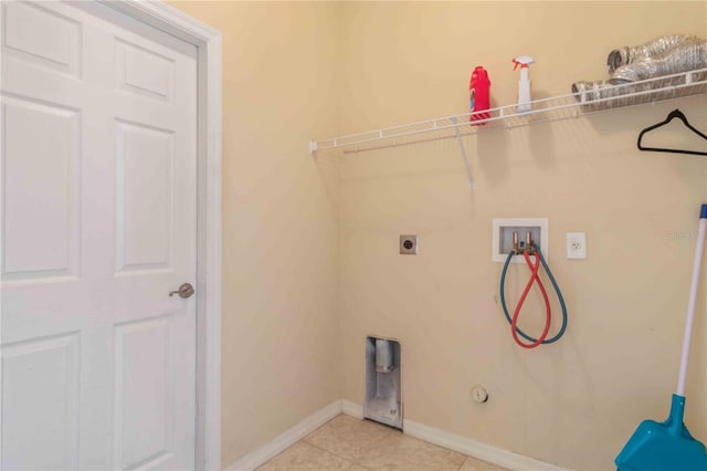 laundry area with electric dryer hookup, gas dryer hookup, hookup for a washing machine, and light tile patterned floors