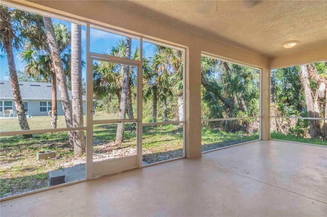 unfurnished sunroom featuring a wealth of natural light