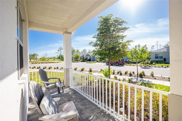 balcony featuring covered porch