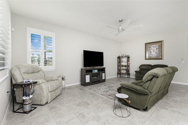 tiled living room featuring ceiling fan