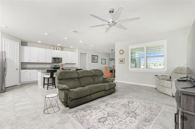 living room featuring ceiling fan