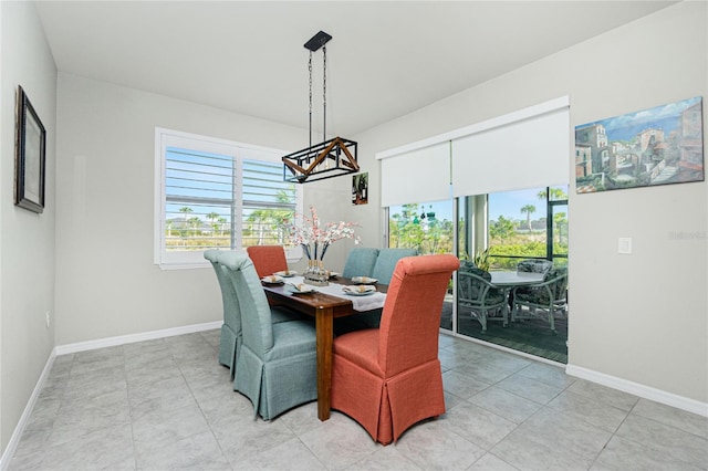 dining area featuring light tile patterned floors