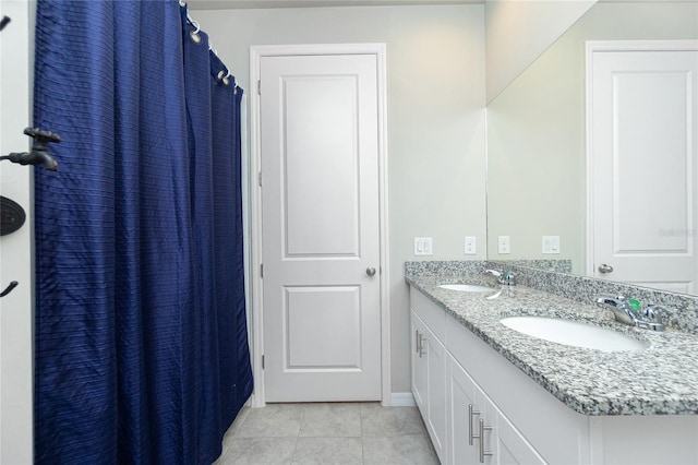 bathroom featuring tile patterned floors and vanity