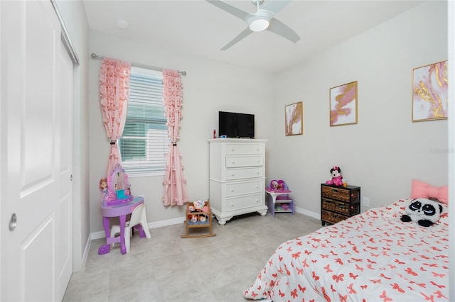 bedroom with ceiling fan and a closet