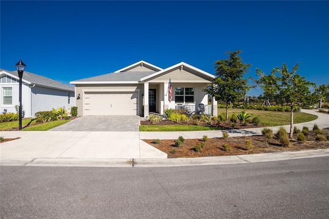 view of front of home with a porch and a garage