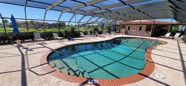 view of pool featuring a lanai and a patio