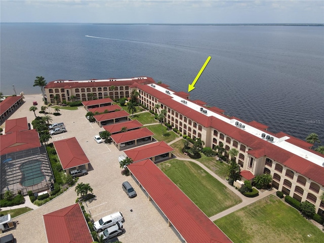 birds eye view of property with a water view