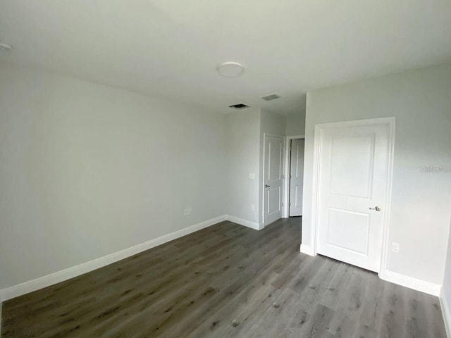 empty room featuring hardwood / wood-style flooring