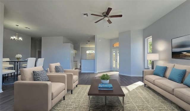 living room with wood-type flooring and ceiling fan with notable chandelier