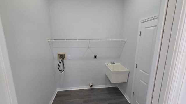 laundry room featuring washer hookup, electric dryer hookup, dark wood-type flooring, and sink