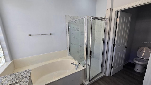 bathroom with hardwood / wood-style flooring, toilet, and independent shower and bath