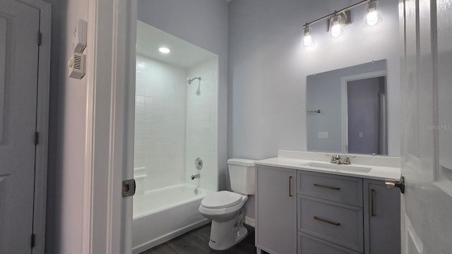 full bathroom featuring shower / tub combination, vanity, wood-type flooring, and toilet