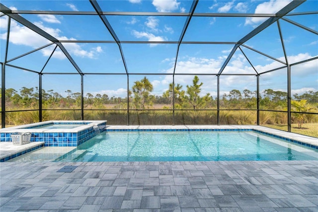 view of swimming pool with glass enclosure