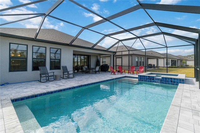 view of pool featuring a lanai, an in ground hot tub, and a patio