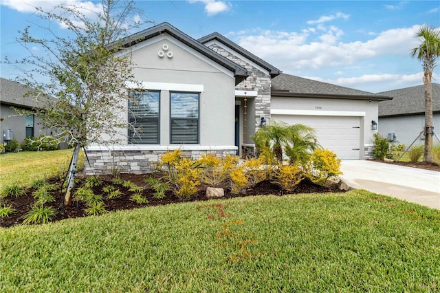 view of front of property featuring a front yard and a garage