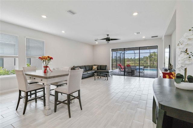 dining area featuring ceiling fan and light hardwood / wood-style floors