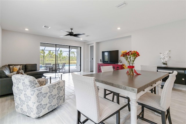 dining area featuring ceiling fan and light hardwood / wood-style flooring