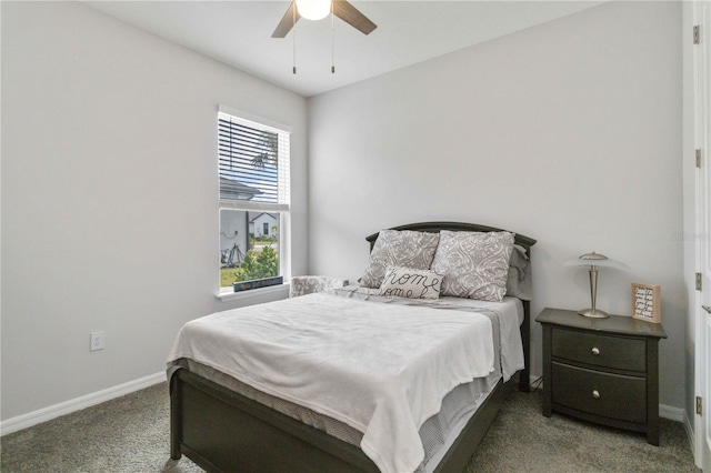 bedroom with dark colored carpet and ceiling fan