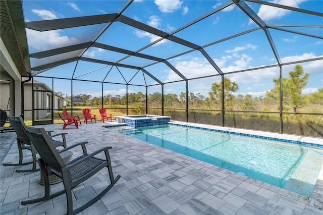 view of swimming pool featuring glass enclosure, an in ground hot tub, and a patio