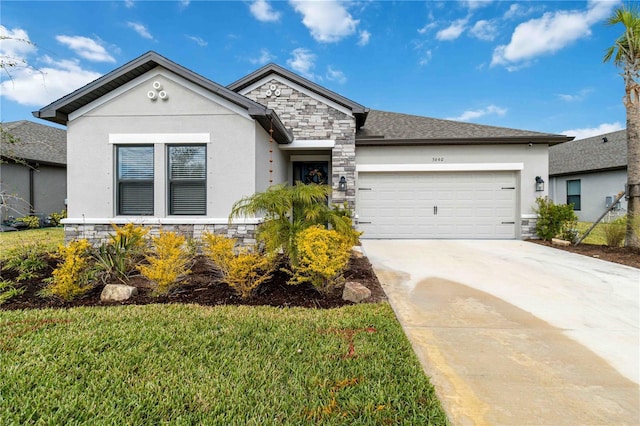 view of front facade with a front yard and a garage