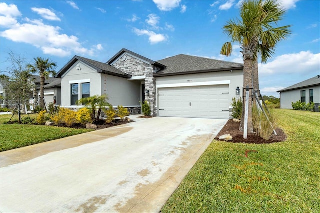 view of front facade with a garage and a front lawn