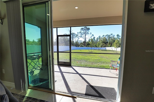 entryway featuring tile patterned flooring and a water view