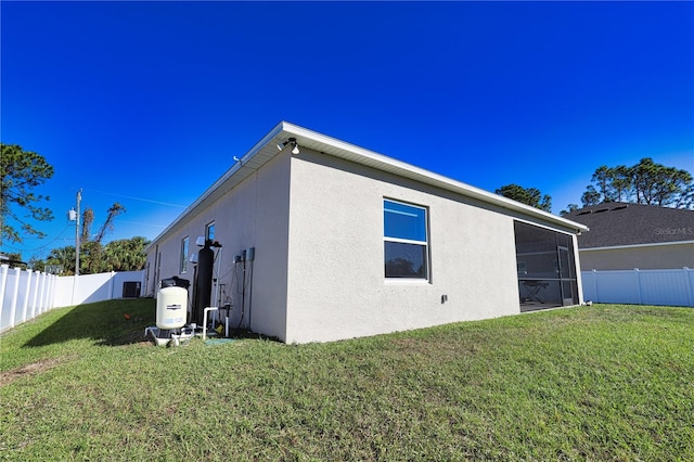 view of home's exterior with a yard