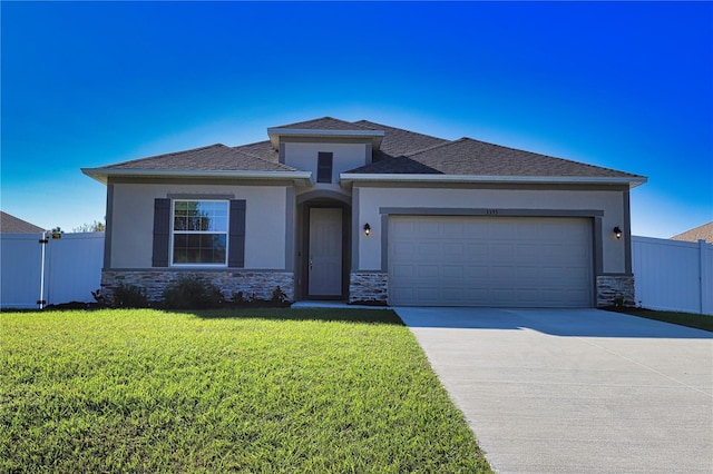 3393 Kacher Rd, North Port, FL 34288 - prairie-style house featuring stone siding, concrete driveway, an attached garage, stucco siding, and a shingled roof