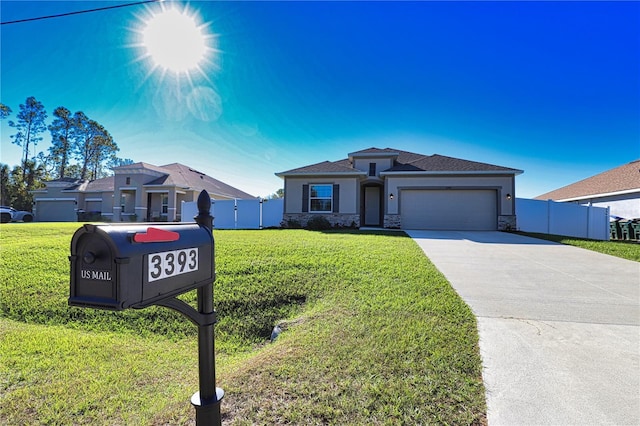 3393 Kacher Rd, North Port, FL 34288 - view of front of house featuring an attached garage, stone siding, stucco siding, and concrete driveway