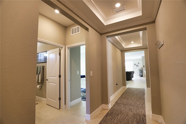 3393 Kacher Rd, North Port, FL 34288 - corridor with a tray ceiling, ornamental molding, light tile patterned flooring, and a textured wall
