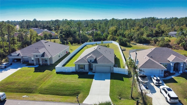 3393 Kacher Rd, North Port, FL 34288 - aerial view of property and surrounding area with a heavily wooded area