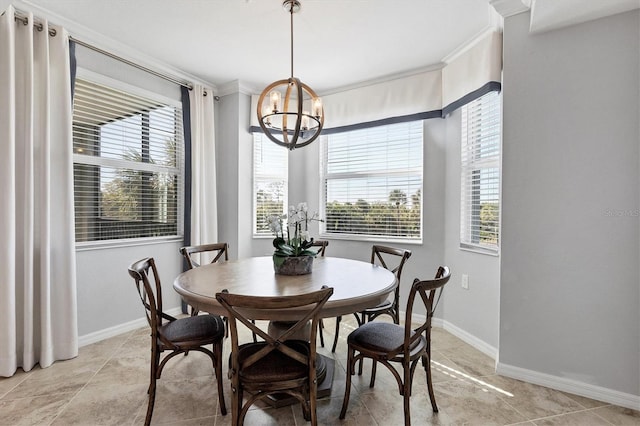 dining area with crown molding, light tile patterned floors, and a chandelier