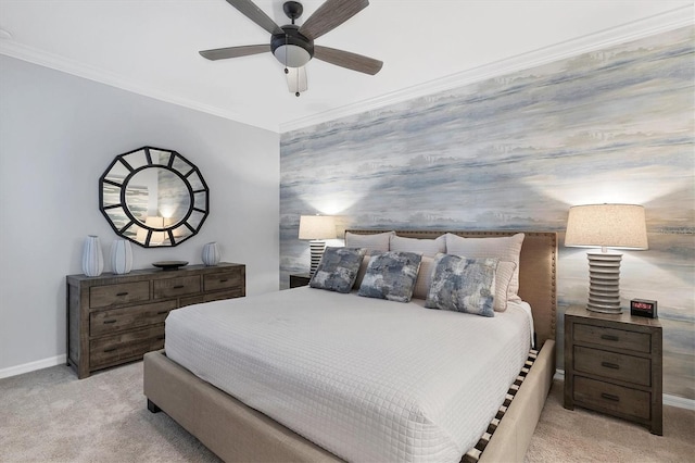 carpeted bedroom with ceiling fan and ornamental molding