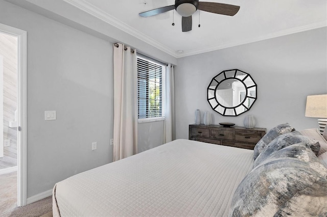 bedroom featuring ceiling fan, carpet, and ornamental molding