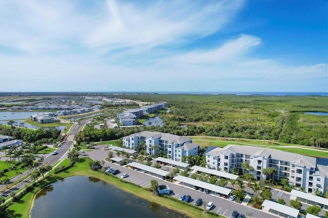 birds eye view of property featuring a water view