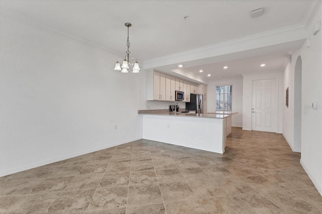 kitchen featuring stainless steel appliances, a notable chandelier, kitchen peninsula, white cabinets, and ornamental molding