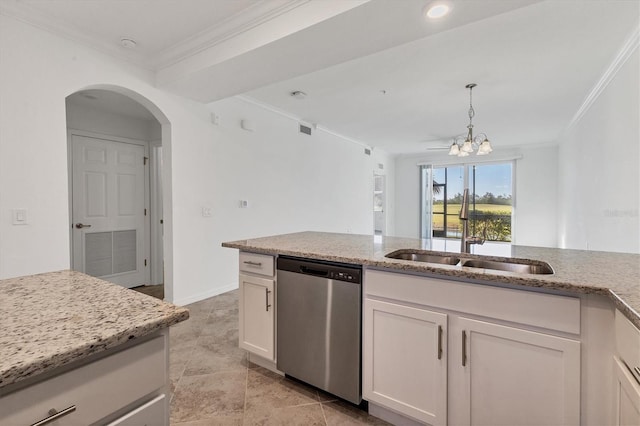 kitchen with stainless steel dishwasher, white cabinets, and light stone countertops