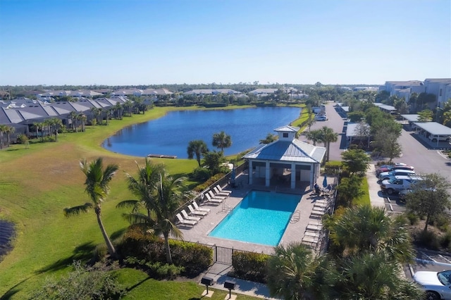 birds eye view of property with a water view