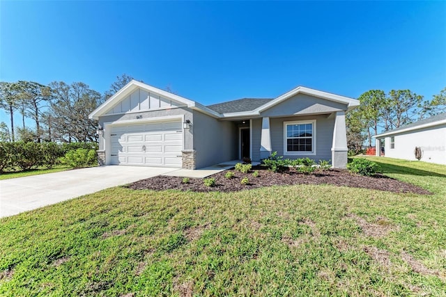 view of front of home with a front lawn and a garage