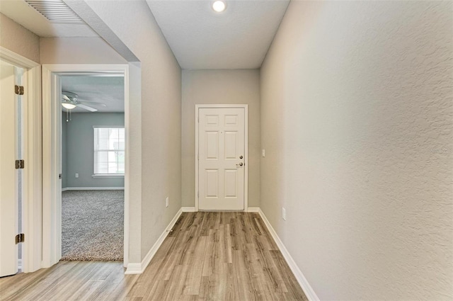 hallway featuring light wood-type flooring