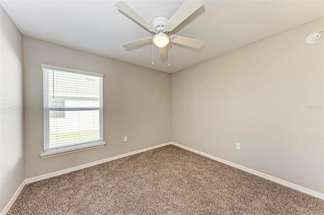 unfurnished room with carpet flooring and ceiling fan