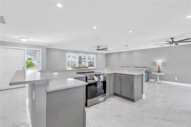 kitchen featuring electric range, a wealth of natural light, crown molding, and ceiling fan