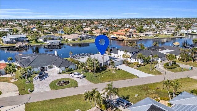 birds eye view of property featuring a water view