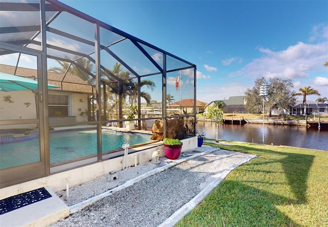 view of pool featuring a lanai, a yard, and a water view